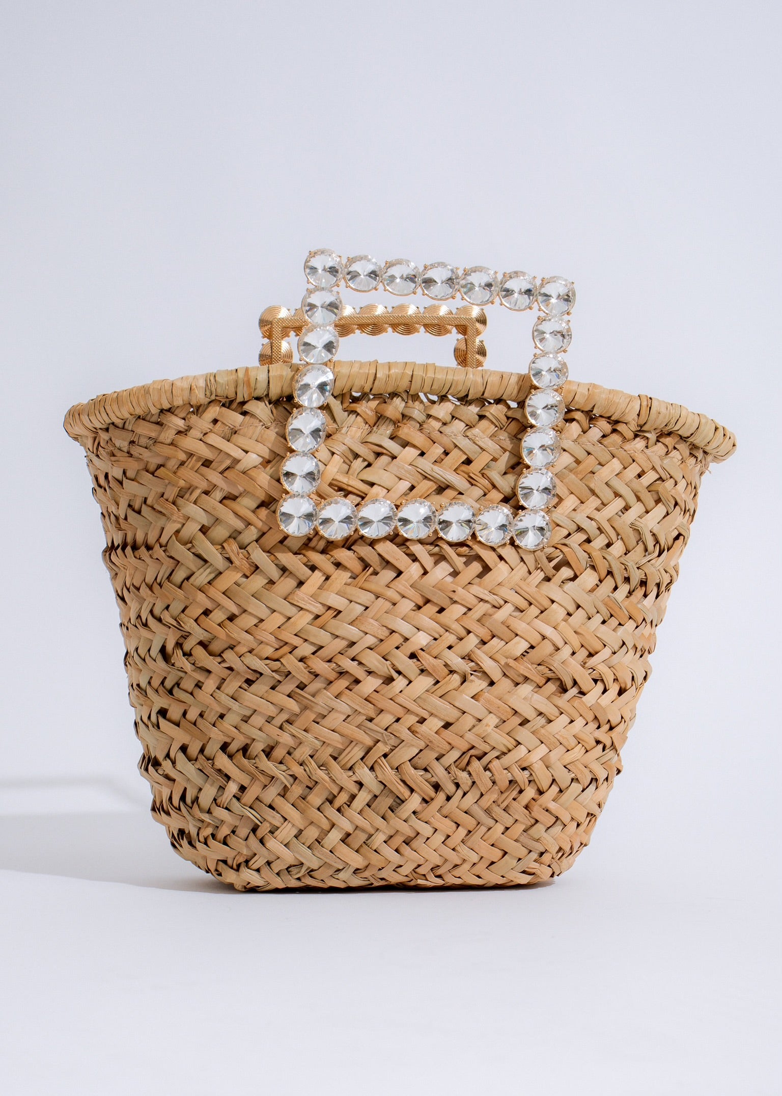 Stylish nude handbag with gold hardware and adjustable shoulder strap