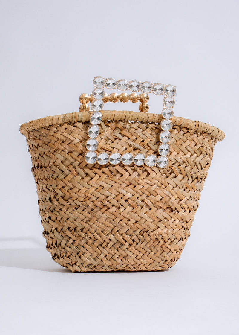 Stylish nude handbag with gold hardware and adjustable shoulder strap