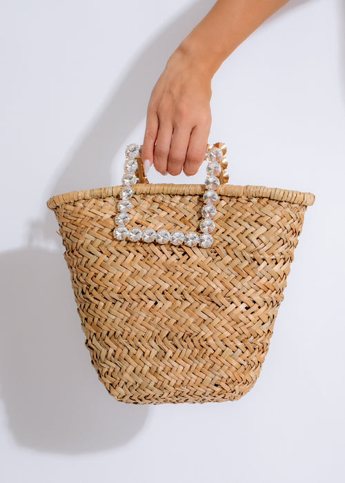 Stylish nude handbag with gold hardware and adjustable shoulder strap