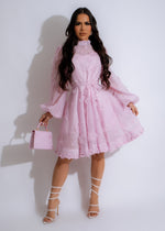 Beautiful chiffon pink mini dress with a flattering v-neck and ruffle details
