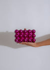 Stylish and elegant purple clutch with gold embellishments and chain strap for a chic evening look 