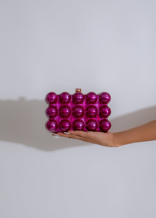 Stylish and elegant purple clutch with gold embellishments and chain strap for a chic evening look 