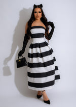 Beautiful white midi dress with floral lace detailing and a flattering silhouette, perfect for any special occasion or event