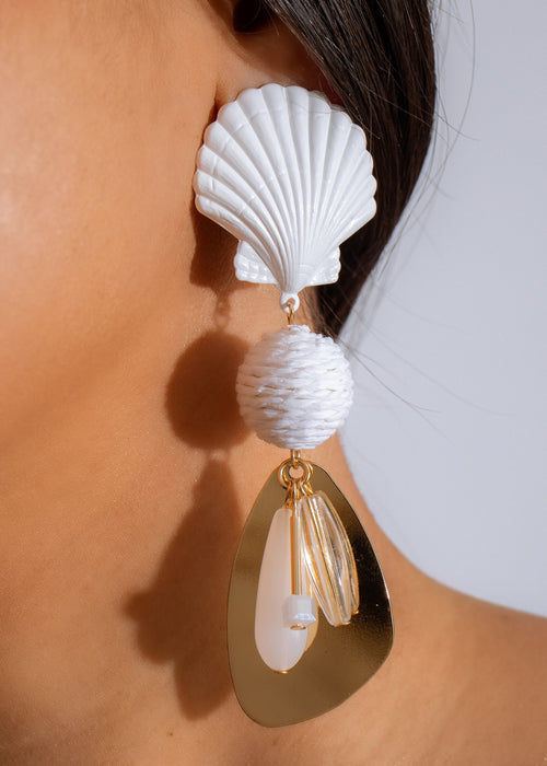 
Beautiful handcrafted white shell earrings inspired by the tranquility of the sea
