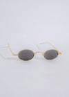 Stylish gold sunglasses with reflective lenses and sleek frame for women 