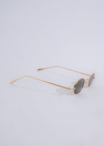  High-quality designer sunglasses in gold color with UV protection and fashion-forward design