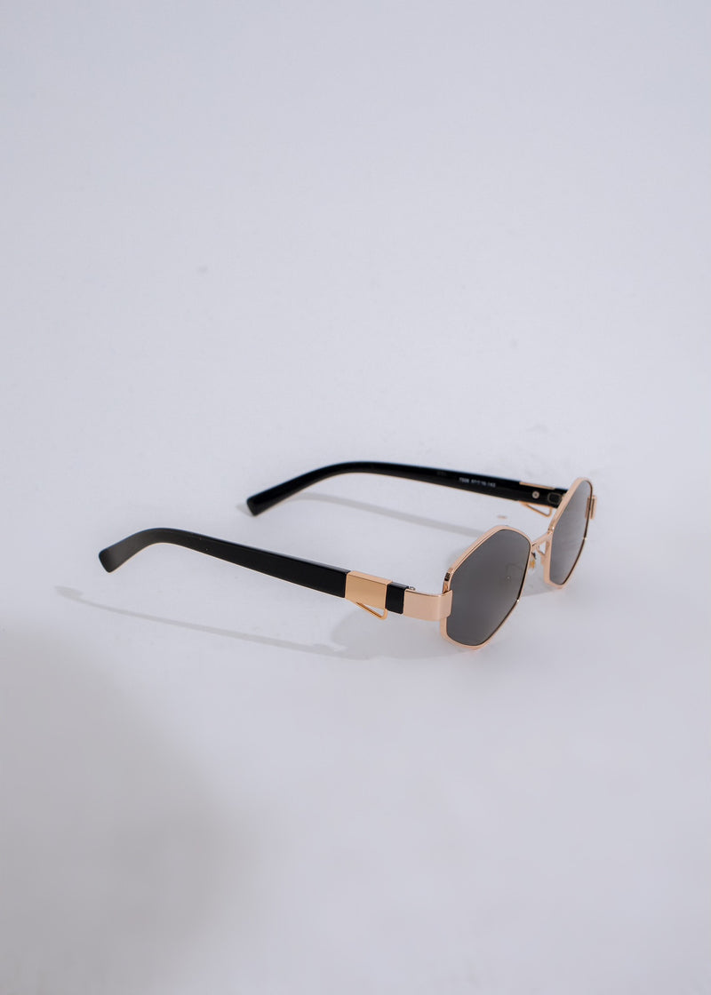  Trendy black sunglasses featuring oversized frames and gold accents