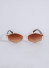  Chic and elegant brown sunglasses featuring cat-eye shape and sturdy construction