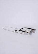 Stylish silver sunglasses with reflective lenses and a sleek, modern design