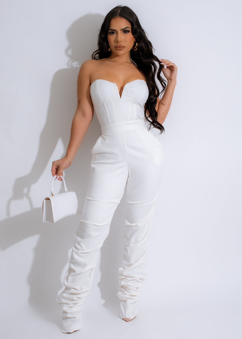 Stunning white ruched jumpsuit with a flattering silhouette and V-neckline
