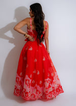 Red maxi dress with flowing skirt and adjustable tie straps