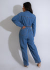 A stylish and trendy denim jumpsuit with intricate rhinestone embellishments