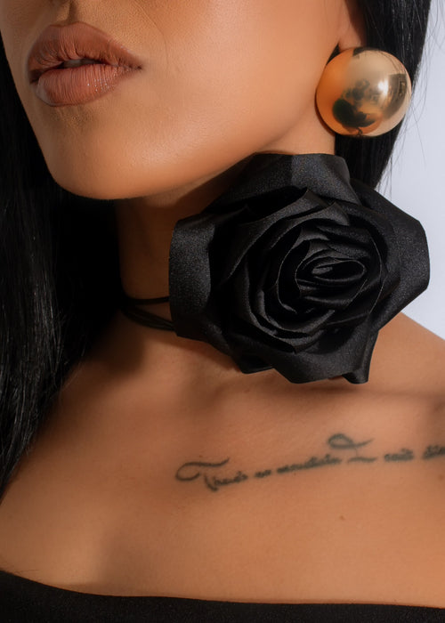 Black choker necklace with delicate floral design, perfect for adding a touch of elegance to any outfit