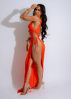 Alt text: Stunning In The Resort Ruched Maxi Dress Orange, perfect for beach vacations and summer getaways, featuring a flattering ruched design and vibrant orange color
