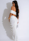  Model wearing Never The Same Ruched Skirt Set White, showcasing the flattering ruched skirt and coordinating crop top, ideal for a fashionable and sophisticated ensemble