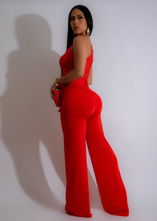 Close-up of the ruched detailing on the She's Amazing Ruched Jumpsuit Orange in bright orange color