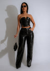 Black faux leather pant set with matching top and edgy details