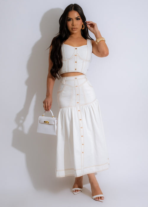 Two-piece white denim skirt set with matching crop top and skirt, perfect for a casual yet stylish look 