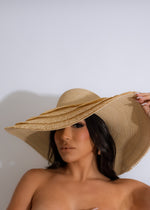 Stylish and chic Luxury Vacay Hat in a neutral nude color, perfect for a fashionable and glamorous beach getaway