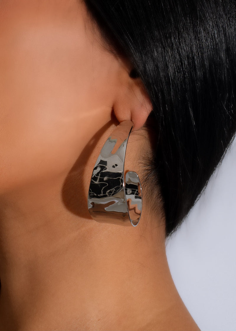 Shimmering silver luxurious nights earrings, featuring intricate filigree and sparkling gemstones