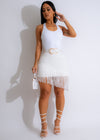White fringe skirt with a flowing, bohemian design perfect for summer