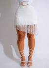 White fringe skirt with a flowing design, perfect for adding movement to any outfit
