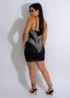 Side view of Shining Light Diamonds Mini Dress Black showcasing the form-fitting silhouette, plunging neckline, and sparkling details that exude sophisticated and luxurious vibes