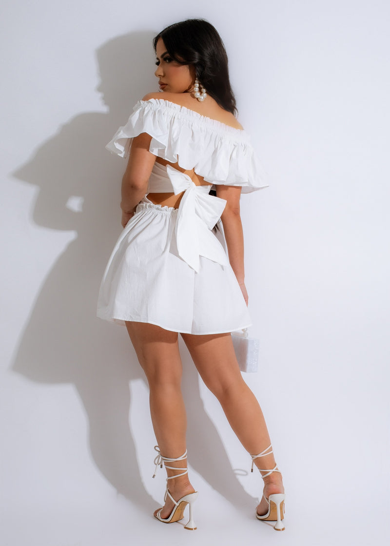 Adorable white Angel Face Ruffle Romper with delicate lace and bow details