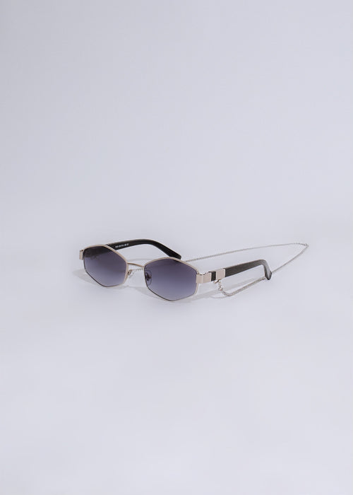 Stylish silver sunglasses with mirrored lenses and delicate frame details for a glamorous look