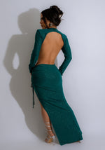 An image of a glamorous green glitter maxi dress, perfect for special occasions and evening events