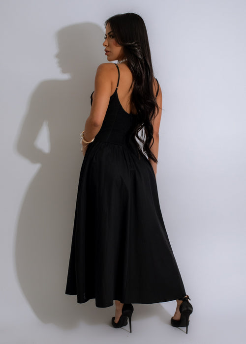 Elegant and timeless black midi dress with a stylish bow detail