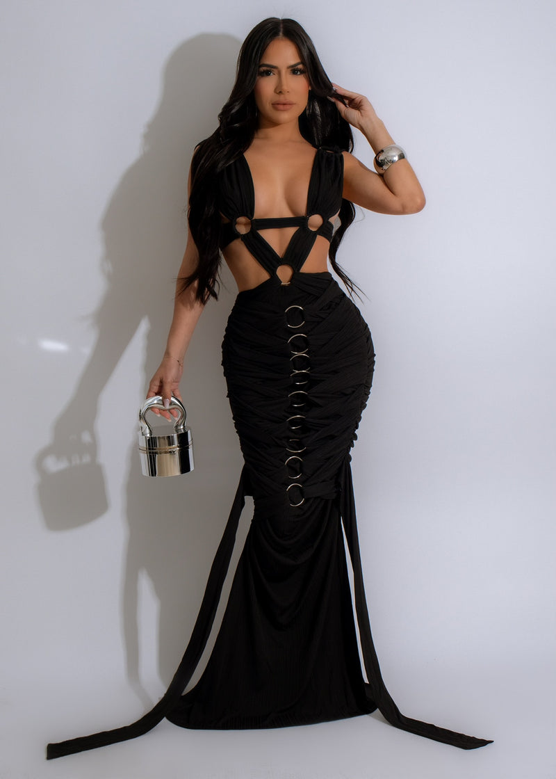 Full-length black maxi dress with flowing skirt and desert dunes print
