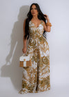 Alt text: Light and flowy brown jumpsuit with a flattering tie waist and deep v-neck neckline, perfect for a tropical vacation or summer outing