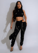 ###
Edgy black jeans with chain detailing for a bold and stylish look