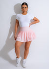 Namaste pink tennis skirt with pleated design and built-in shorts