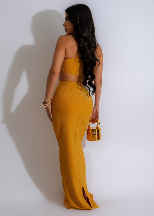  Elegant and stylish female model showcasing the sexy diva in glitter skirt set gold, featuring a dazzling outfit that exudes confidence and sophistication