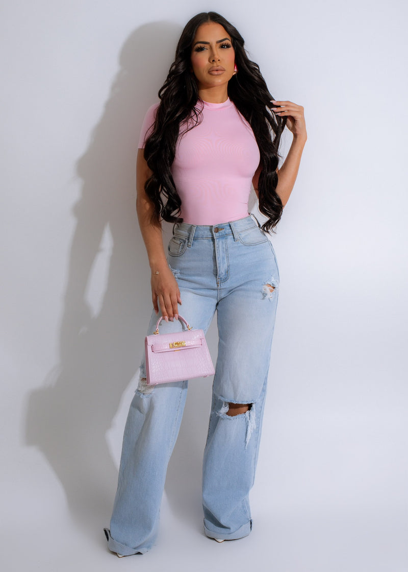 A feminine and stylish pink bodysuit with a flattering fit