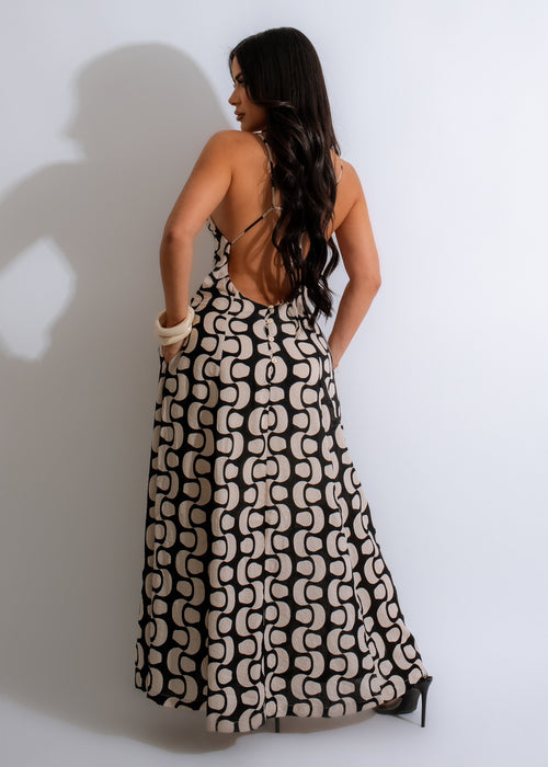  Gorgeous woman wearing a black maxi dress with a flowy skirt