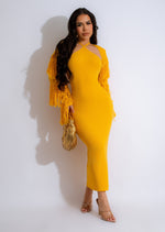 Close up of yellow ribbed midi dress with trendy fringe detail, perfect for hot summer days and evenings 