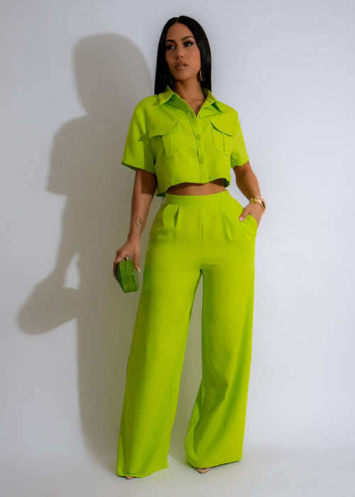 Two-piece green pant set featuring a crop top and high-waisted pants