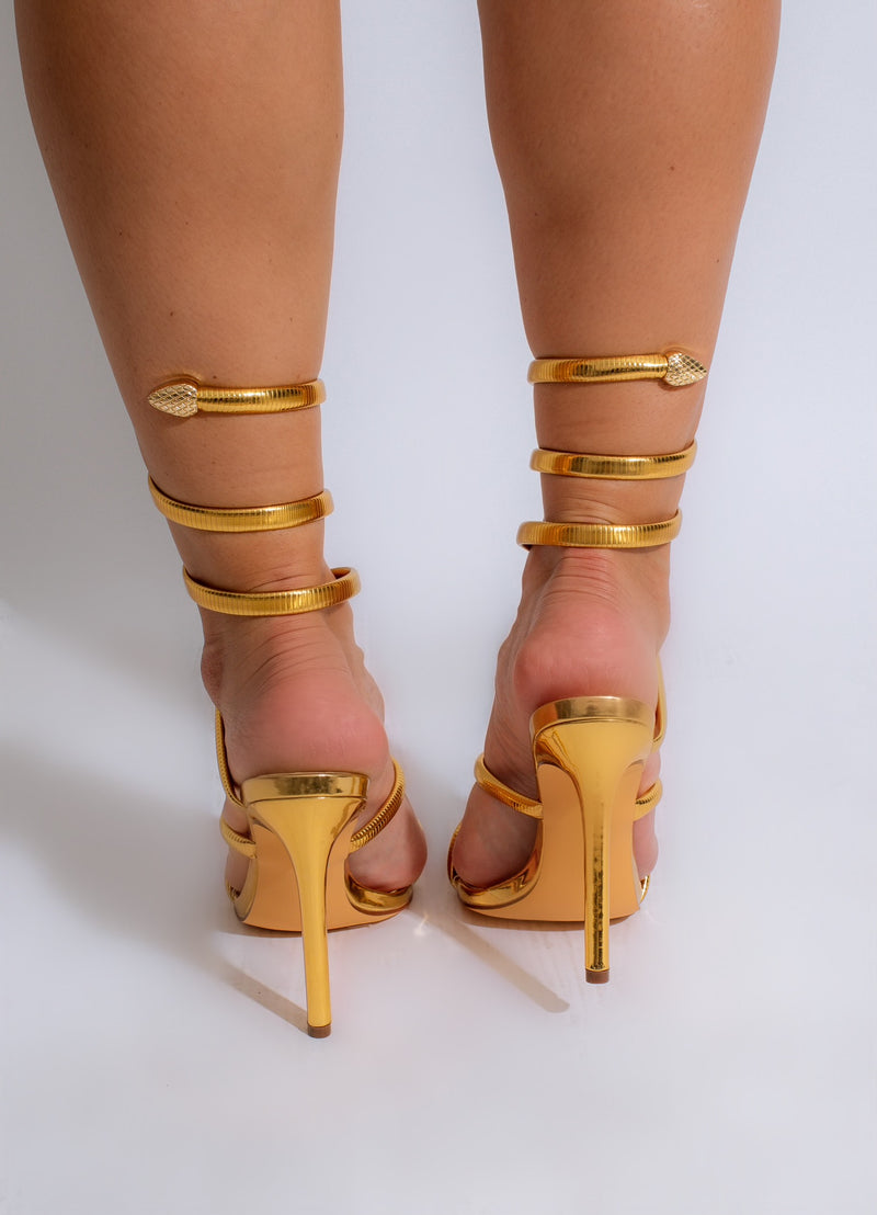 Fashionable and chic gold heels with a metallic shine for a statement-making outfit