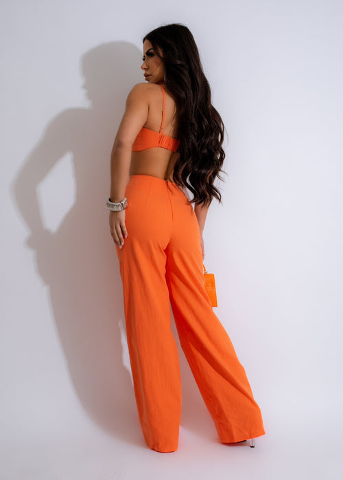 Sunny Vibes Jumpsuit Orange - This eye-catching jumpsuit features a trendy orange hue, wide-leg silhouette, and a comfortable, lightweight fabric, ideal for sunny and warm weather