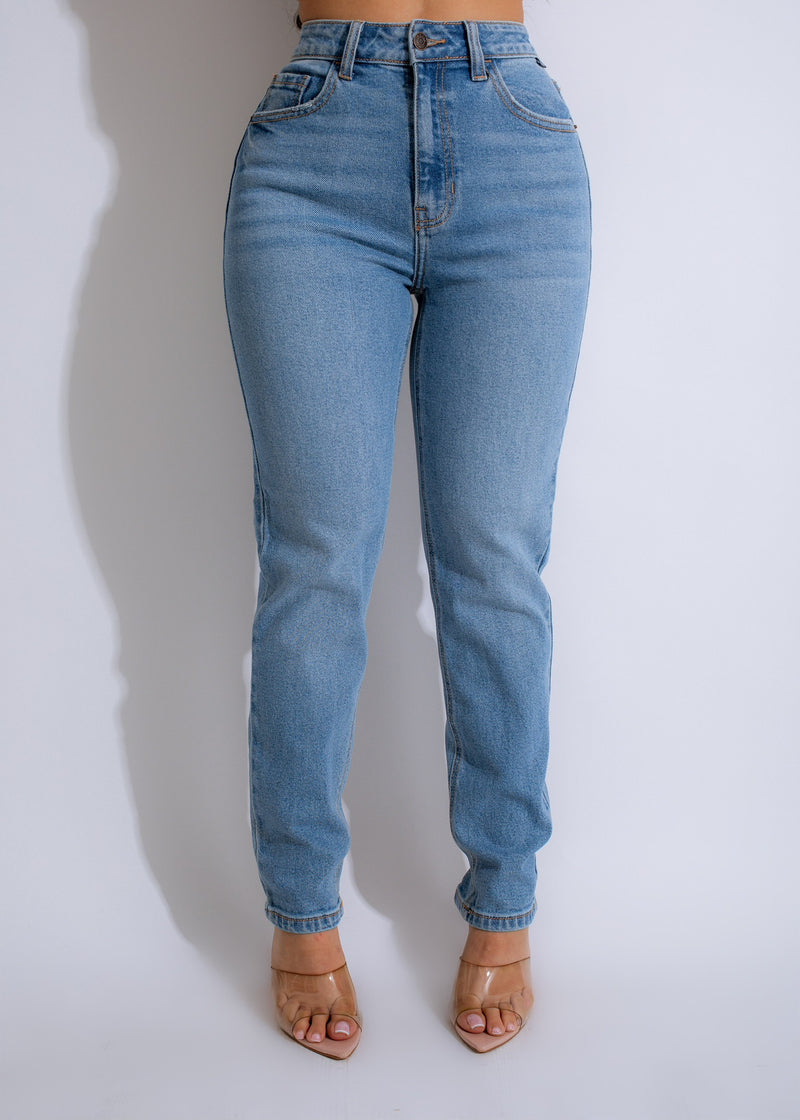 Light blue denim jeans with distressed details and a relaxed fit