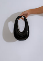 Stylish black Bad Habit handbag with gold hardware and adjustable strap 