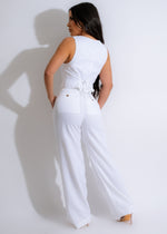 Pair of white linen pants folded and laid flat to show details