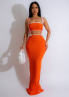 Monochrome Muse Ribbed Maxi Dress Set Orange on model walking in garden