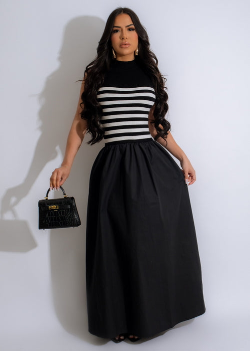 A black knit maxi dress with a lot of money print