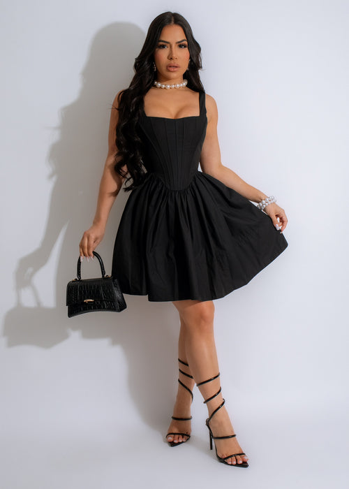 Stunning black mini dress with lace detailing and sweetheart neckline for a chic and elegant look perfect for any special occasion or night out