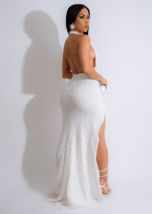 Beautiful white maxi dress with a flowing silhouette, perfect for vacation