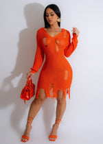 Orange crochet mini dress with intricate detailing and a flirty silhouette